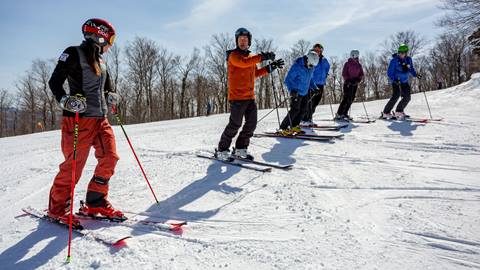 ski coach with students 