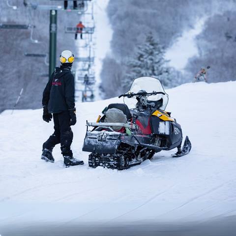 Snow maker in front of chairlift