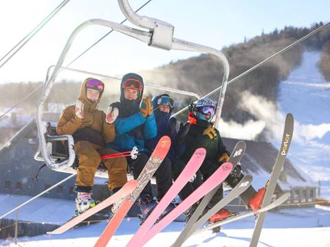 Skiers on a lift