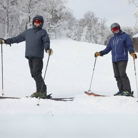 foilks on a chairlift 