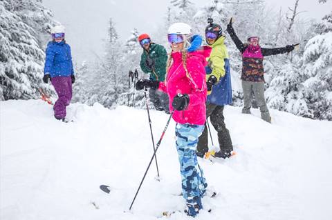 friends skiing in the snow