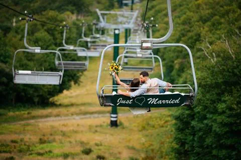 Bride and Groom ride Just Married decorated chairlift 